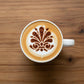 Set of cookie stencils applied to the top of a latte