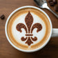 Fleur de Lis design applied to the top of coffee with cocoa powder