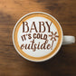 Winter beverage stencil applied to the top of coffee with cocoa powder