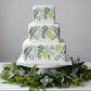 Set of stylized leaf designs in green, gray, and white on a white CAKE