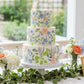 Floral stencil applied to a three-tiered bridal shower cake