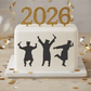 Graduation-themed cake with '2026' and silhouettes of graduates on a white background.