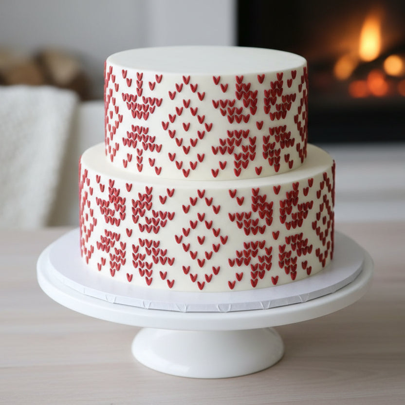 Snowflake Sweater Print stenciled onto the sides of a holiday party cake