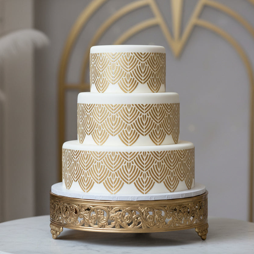 Decorative stencil border that has been applied to a white, multi-tiered cake for a Great Gatsby themed party.