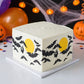 Midnight Madness stencil applied to the sides of a Halloween cake