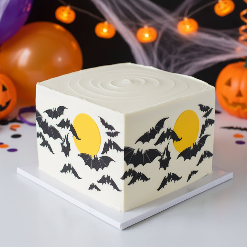 Midnight Madness stencil applied to the sides of a Halloween cake