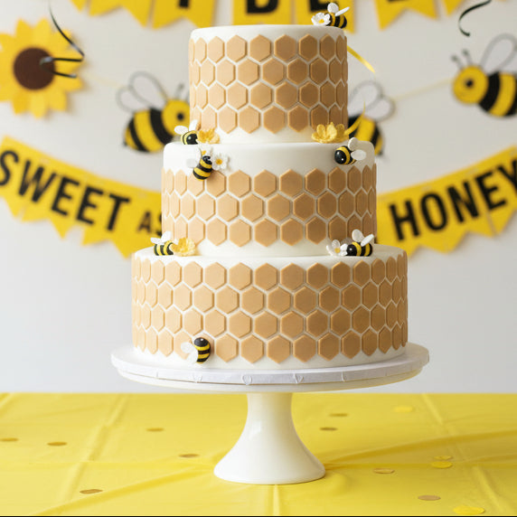 Honeycomb Cake Stencil applied to a multi-tiered cake for a bee themed party.