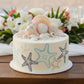 Starfish pattern with blue, orange, and black colors on a white background