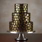 Marquee Dots stenciled onto the sides of a black,iced cake
