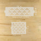 Two geometric pattern stencils with measurements on a wooden surface