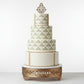 Geometric stencil pattern with triangles and diamonds in beige applied to the side of a gatsby cake