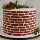 Brick Wall Cake Stencil applied to the side of a barrel style cake
