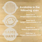 Stencil sheets with 'GAME DAY!' design on a wooden surface, showing different sheet sizes and their corresponding design dimensions.
