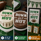 Collage of cakes with 'DOWN set HUT' text, chocolate cheesecake, and decorative items for a sports-themed event.