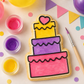 Cake Shaped Paint Your own cookie that has been painted with food coloring with a birthday party backdrop