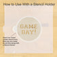Instructions on how to use a stencil holder with a round cookie stencil labeled 'GAME DAY!' on a wooden surface.
