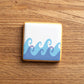 Cookie decorated using the Wave Duo Cookie Stencil Edger