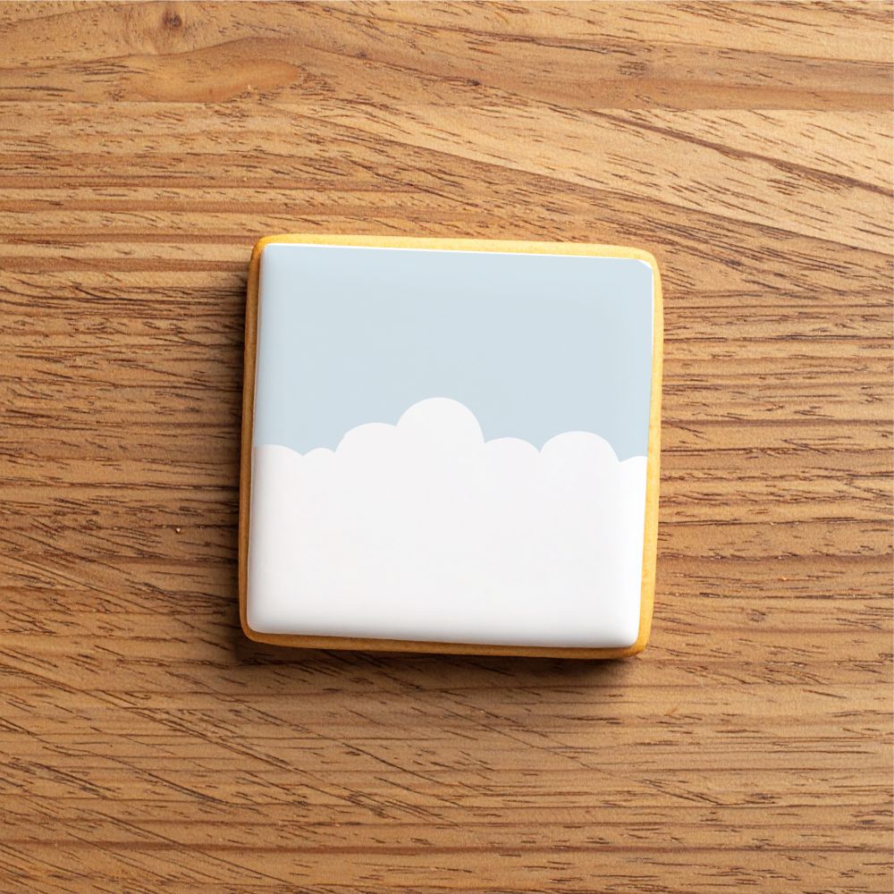 Cookie decorated using the Clouds Cookie Stencil Edger