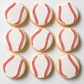 Nine baseball-themed round sugar cookies decorated with white icing and red seam details, arranged in a 3x3 grid on a light background.