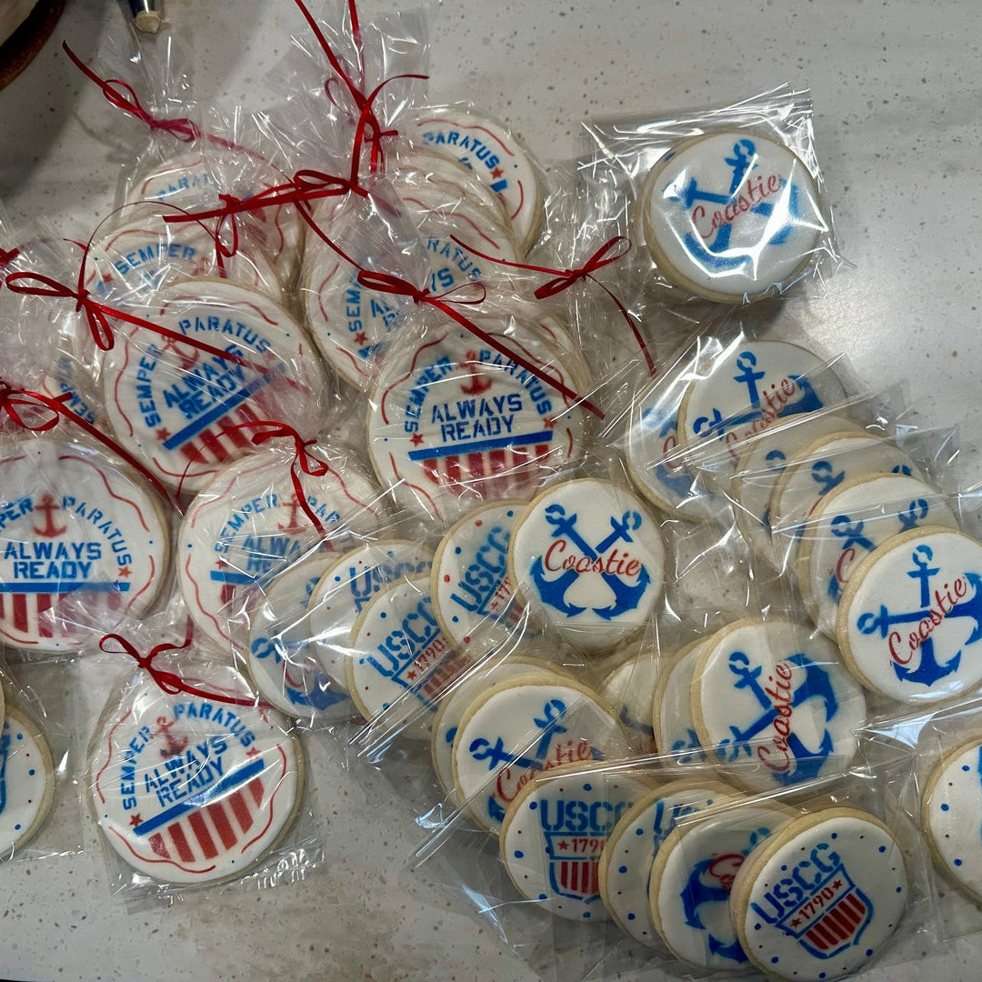 USCG-themed cookies in clear packaging on a white surface