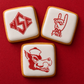 Go Pack Go Cookie Stencil Set applied to three white iced cookies for a NC State party
