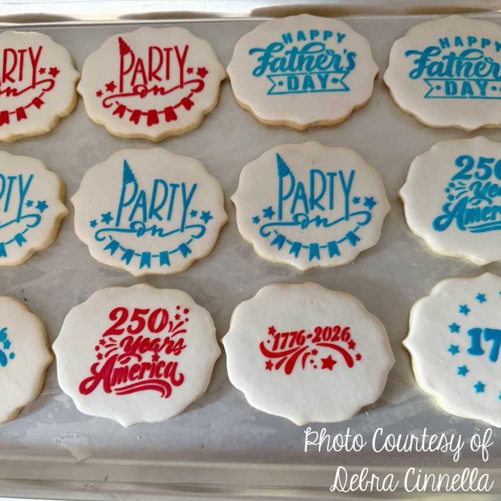 Decorative cookies with Father's Day and birthday messages on a tray.