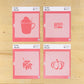 Four pink cookie stencils in their packaging
