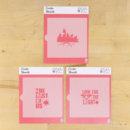 Set of The Last of Us cookie stencils in their packaging laying on a wooden surface.