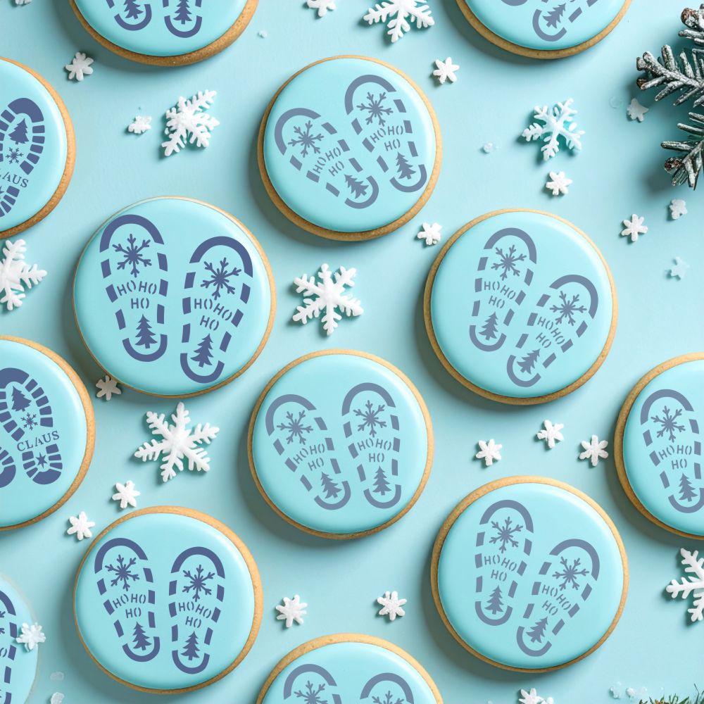 Blue cookies with festive Santa boot print designs on a blue background