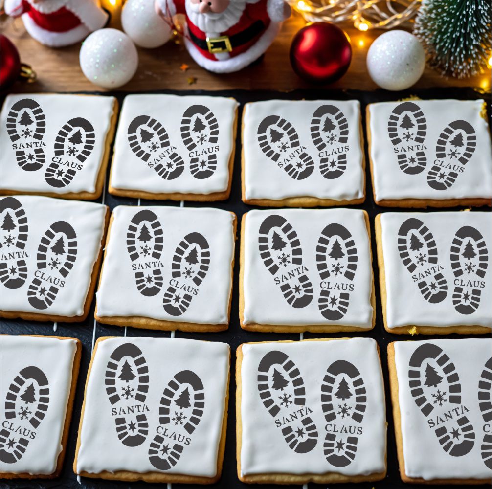 Cookies with Santa Claus footprints and 'Santa Claus' text on a festive background with Christmas decorations.