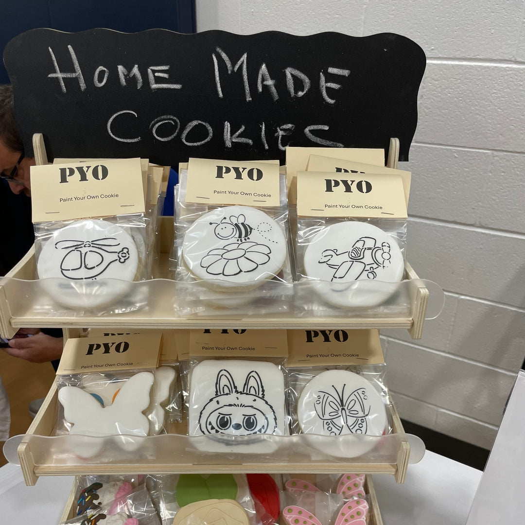 Display of homemade cookies from Ann Santacruz with customizable options on a stand.