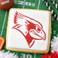 Cardinal mascot stenciled onto an iced cookie