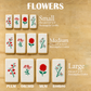 A set of rectangular sugar cookies decorated with different floral designs, arranged in rows on a light wood background with text labels indicating sizes Small, Medium, and Large, and flower names Plum, Orchid, Mum, and Bamboo.