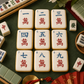 Mahjong Crak Tiles Cookie Stencil Set Applied to white, tile shaped cookies with a mahjong party backdrop