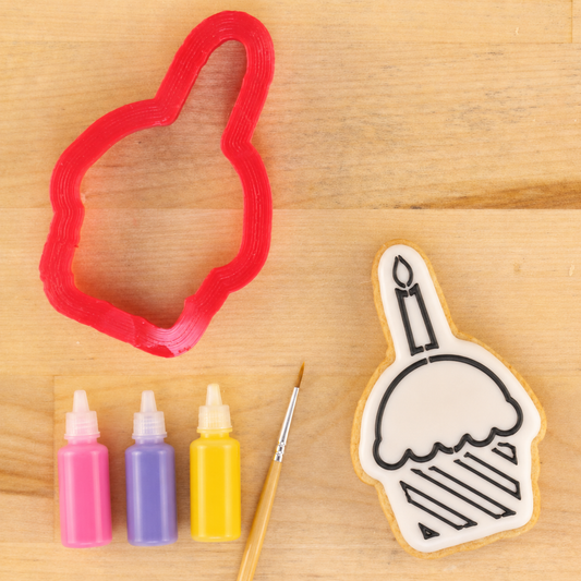 Cupcake Paint Your Own Cookie Next to the matching Cupcake Shaped Cookie Cutter.