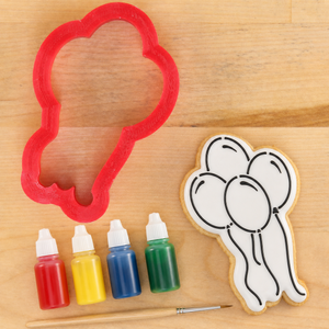 Birthday Balloons Paint Your Own Cookie Next to the Matching Balloon shaped cookie cutter.