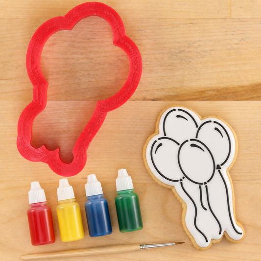 Birthday Balloons Paint Your Own Cookie Next to the Matching Balloon shaped cookie cutter.