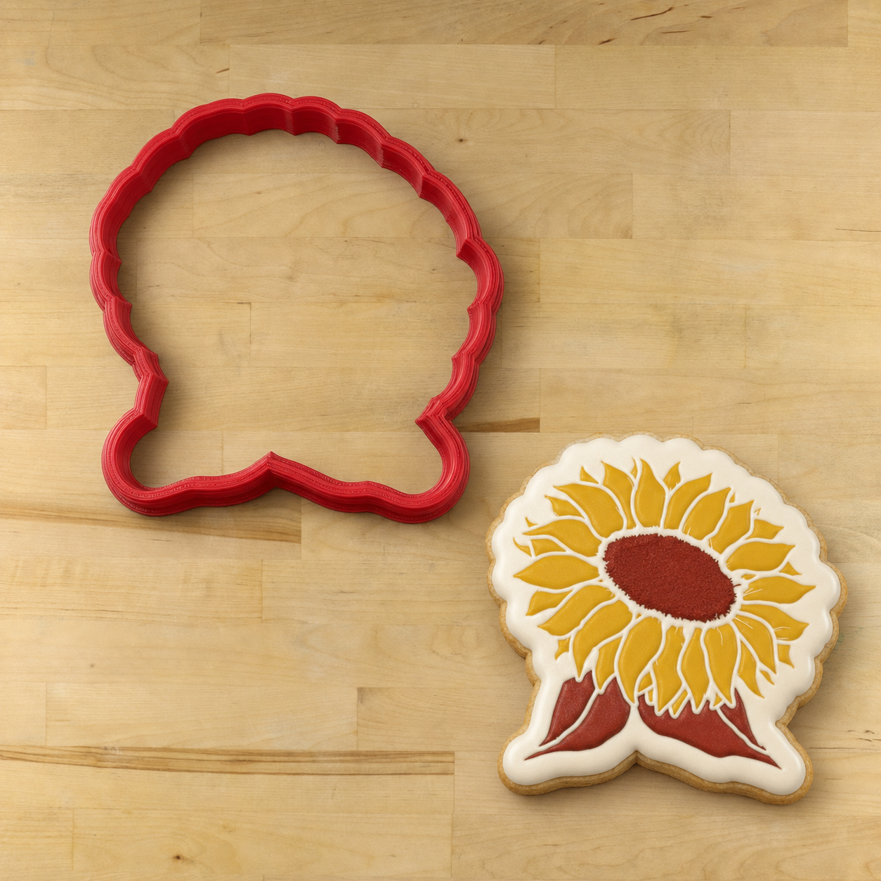 Sunflower Shaped cookie cutter next to a sunflower shaped cookie decorated with the sunflower cookie stencil.
