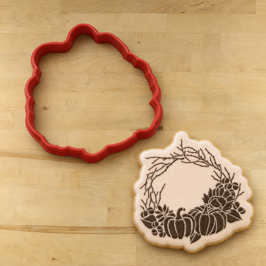 Autumn Wreath Cookie Next to a wreath shaped cookie cutter