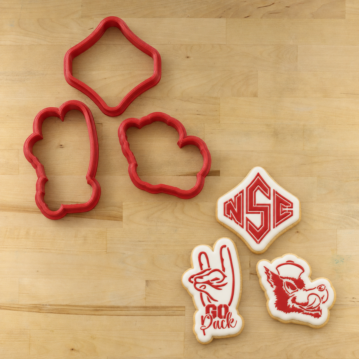Go Pack Go Cookie Cutters and cookies decorated with the matching Go Pack Go Cookie Stencil Set 