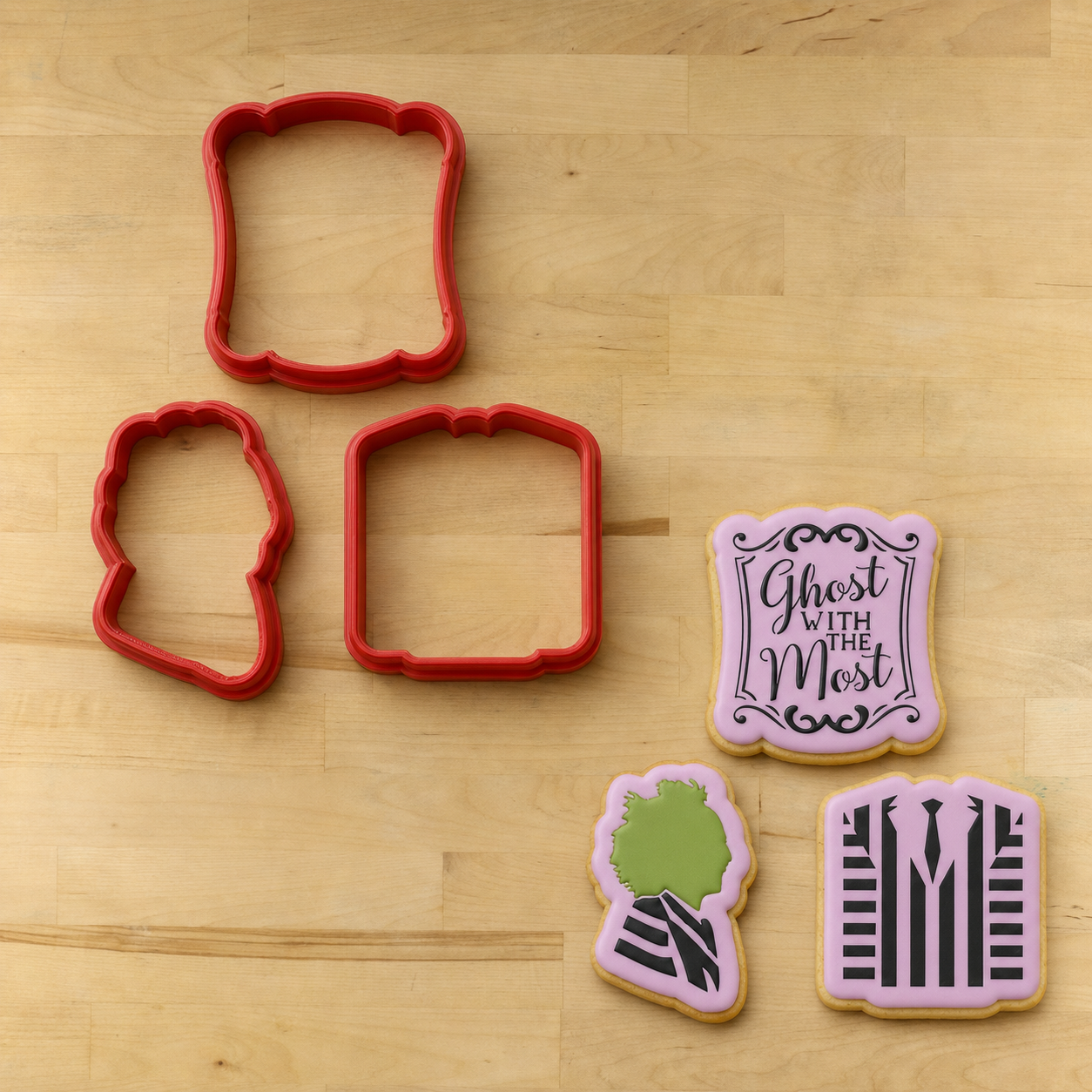 Beetlejuice Cookies next to their matching cookie cutters
