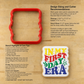 Instruction sheet for making a first day cookie cutter, featuring a red plastic cookie cutter outline, text with design sizing and cutter measurements, care tips, and a colorful 'In My First Birthday' stencil design on a tan paper background.