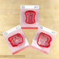 Three red cookie stencils featuring 'Tar Heels', 'The Best Blue', and UNC design for fun baking.