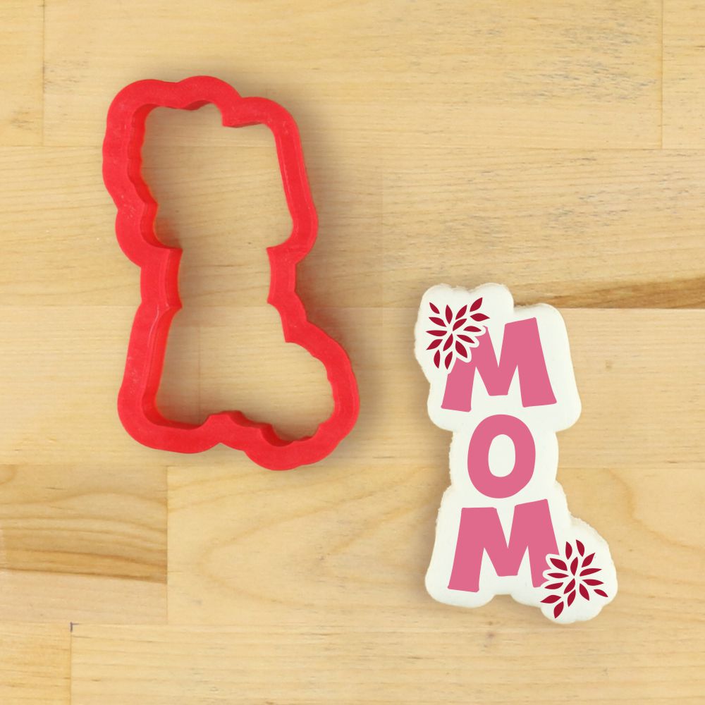 Chrysanthemum Mom cookie stencil and cutter for Mother's Day baking, featuring flower designs and the word 'MOM' in pink.