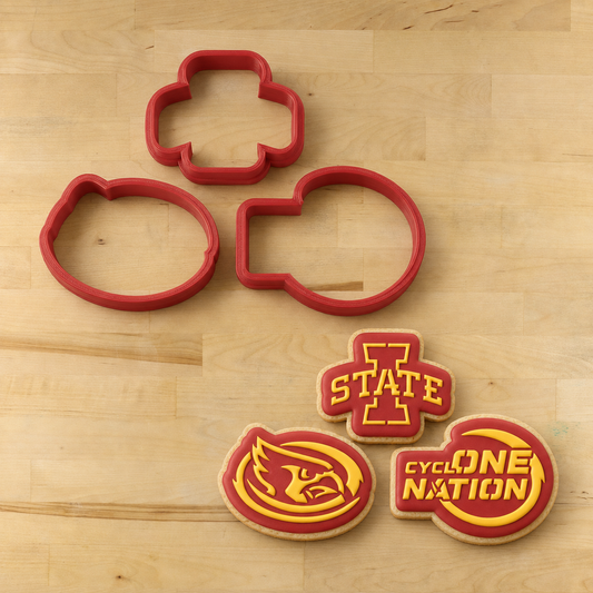 Cyclone Nation Cookie Cutters next to three cookies decorated with the matching Cyclone Nation Cookie Stencil Set