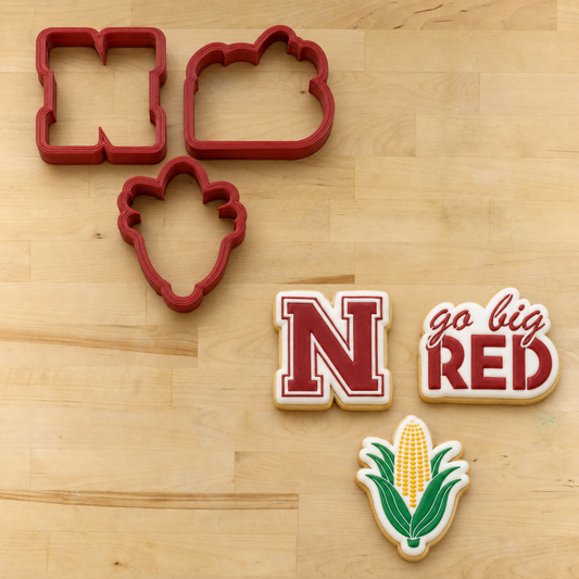 Big Red Nebraska Cornhuskers Cookie Cutter Set next to its matching cookies