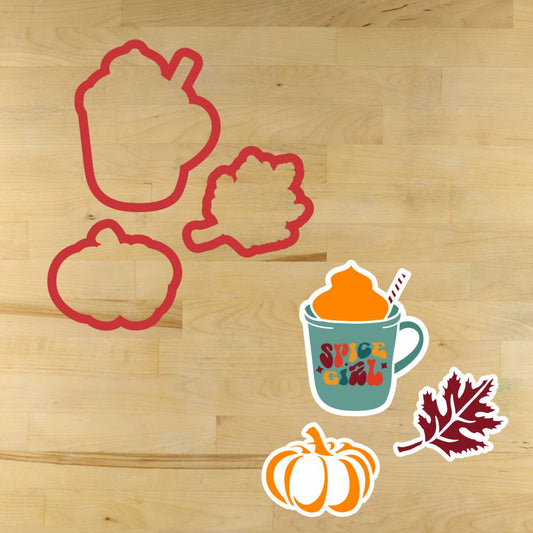 Set of pumpkin spice autumn-themed cookie cutters and stencils on a wooden surface