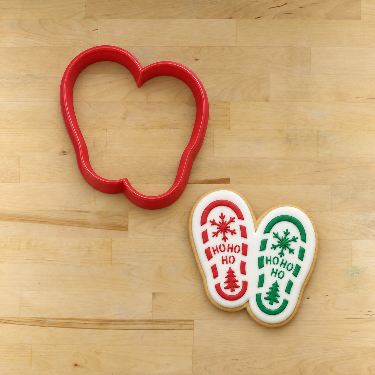 HoHoHo Santa Claus boots next to a matching cookie.
