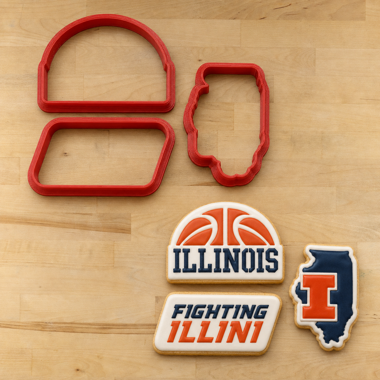 Fighting Illini Cookie Cutters and three Illinois Basketball Cookies, decorated with the Fighting Illini Cookie Stencil Set