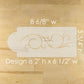 Decorative cake stencil with measurements on a wooden surface